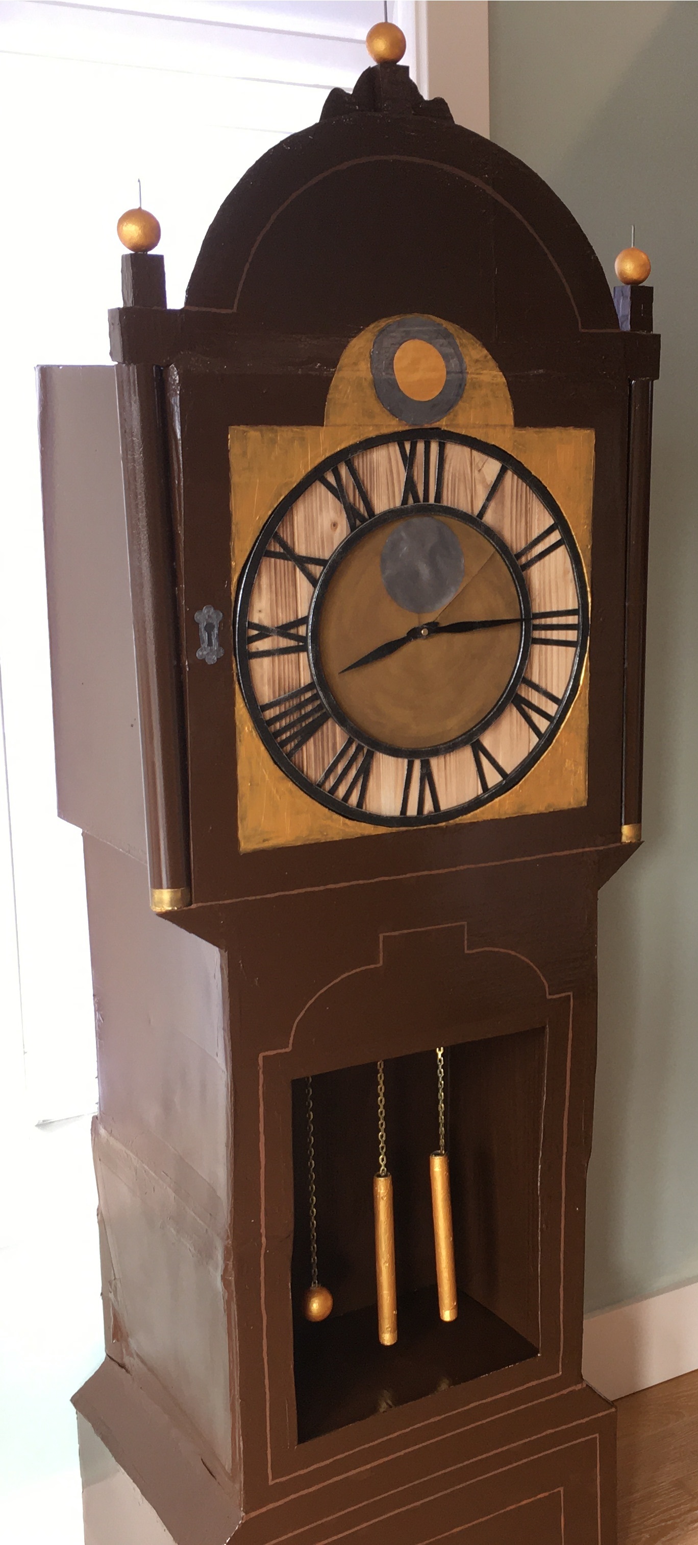 3/4 view of a Stranger Things Haunted House grandfather clock prop