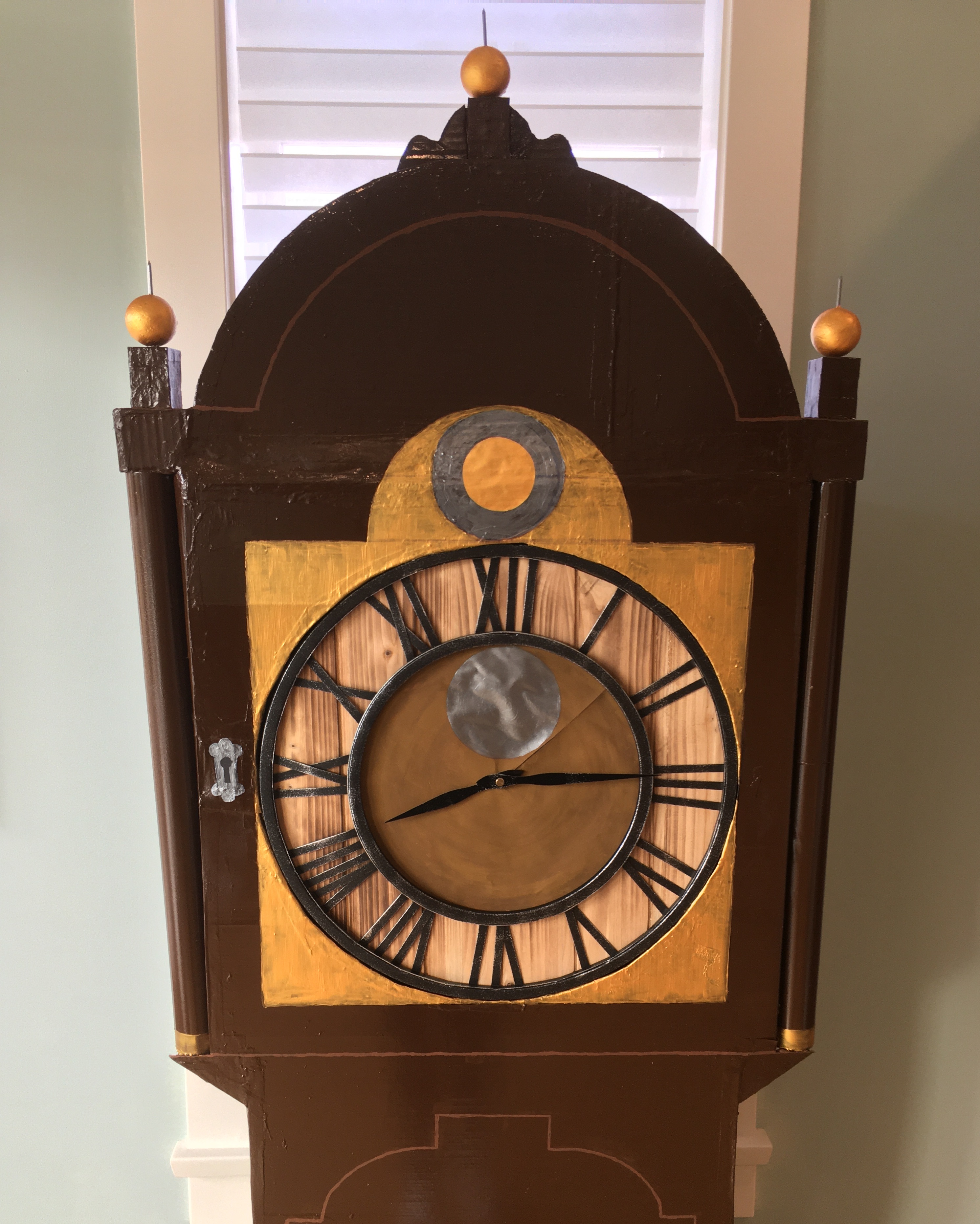 Close up of clock face of a Stranger Things Haunted House grandfather clock prop